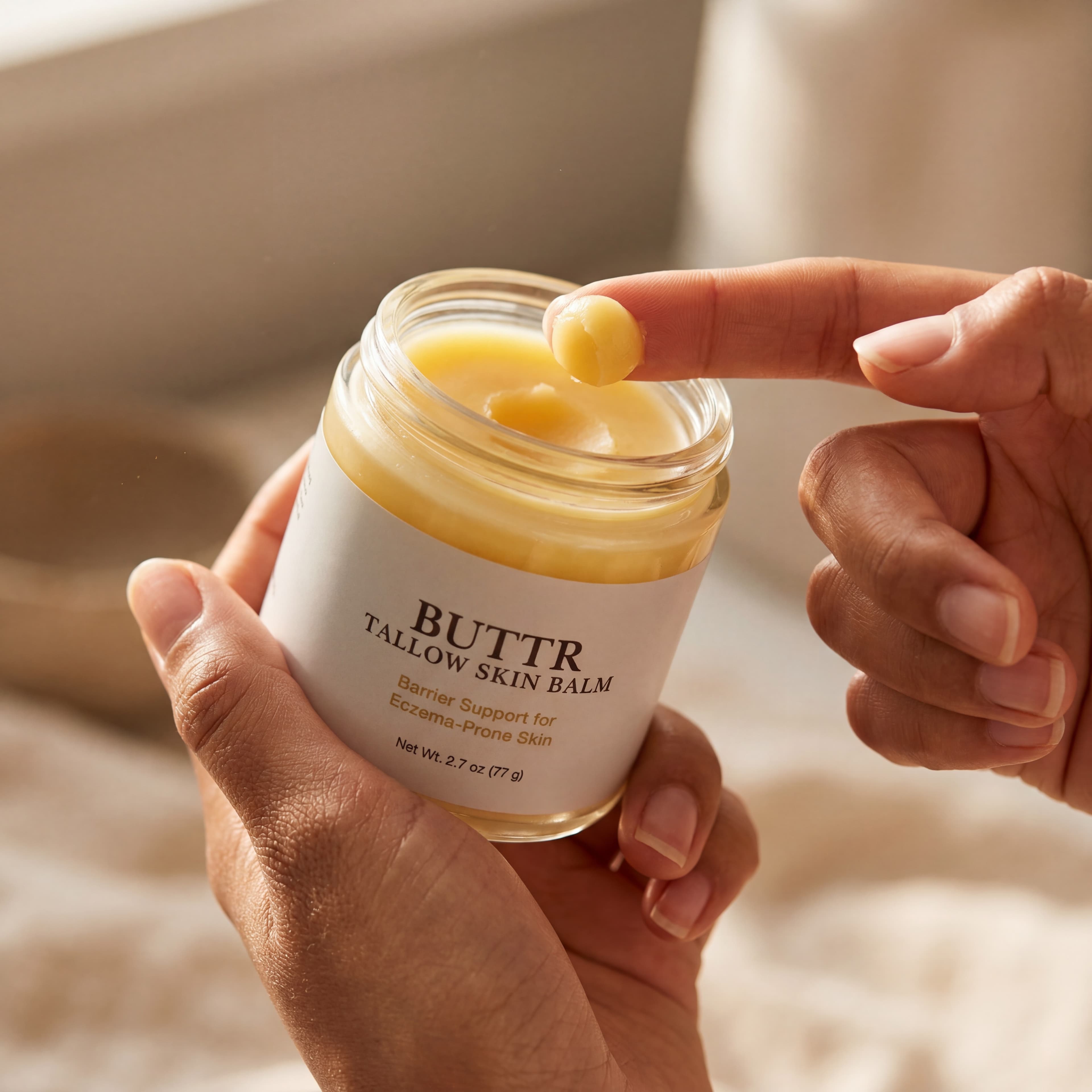 BUTTR Tallow Balm on limestone surface with dried calendula petals